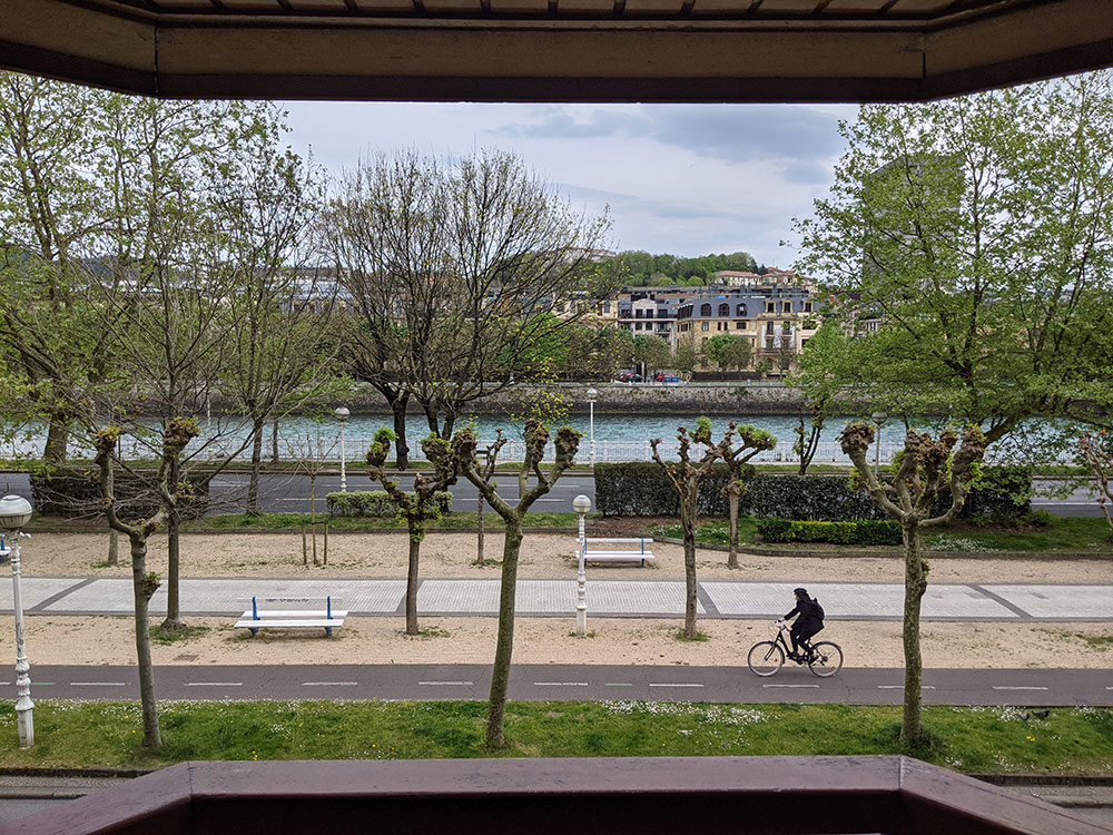 Someone cycling down the walkways around the River Urumea