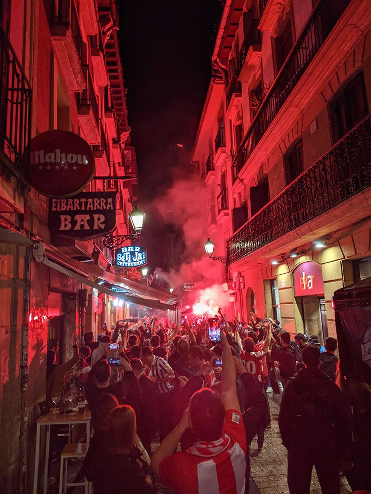 athletic bilbao fans setting off flares in the parte vieja of san sebastian