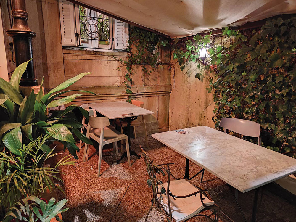 The gardens and outdoor dining area of Kafe Botanika in San Sebastian