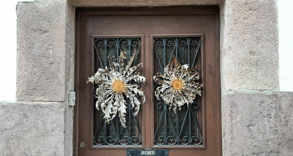 Eguzkilore sunflowers on the doors of homes in the Basque country