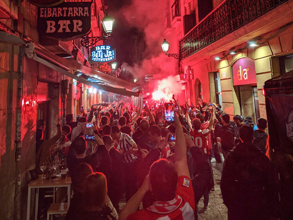 People in the streets of the Parte Vieja in San Sebastian before a footballl match
