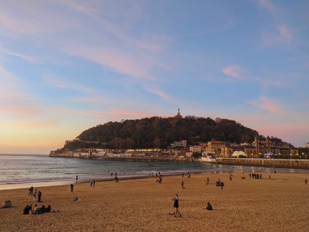 people on la concha beach in San Sebastian in December