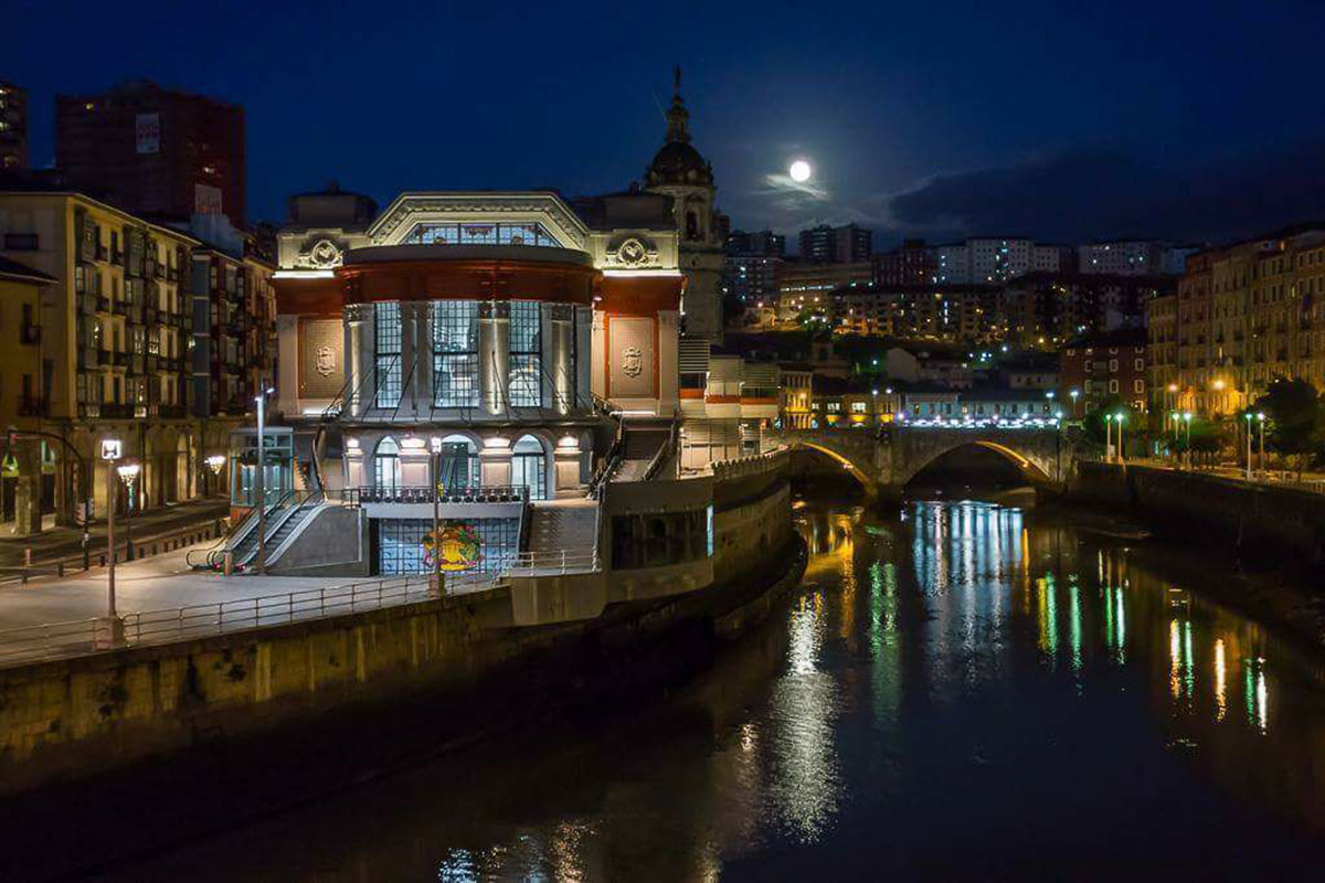 View of the La Ribera Market building in Bilbao at night
